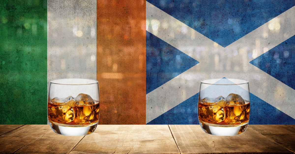 irish whiskey vs scotch graphic with a glass of irish whiskey in front of the ireland flag and a glass of scotch in front of the scotland flag